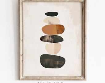 Könnte beinhalten: Ein gerahmter Kunstdruck mit einem vertikalen Stapel aus sechs abstrakten, abgerundeten, steinartigen Formen in Schwarz, Creme, Beige und Terrakotta. Das Kunstwerk befindet sich auf einem hellen, strukturierten cremeweißen Hintergrund.