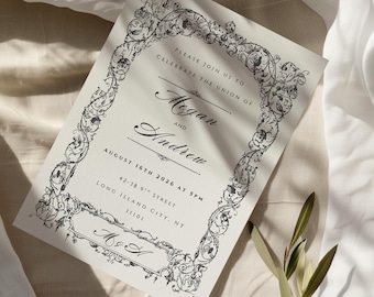 Puede incluir: Una tarjeta de invitación con un borde floral negro adornado. La invitación dice "Por favor, únete a nosotros para celebrar la unión de Megan y Andrew" con la fecha 16 de agosto de 2026. La tarjeta también incluye la dirección 42-38 9th Street, Long Island City, NY 11101.