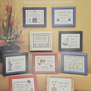 May include: A leaflet titled "From the Proverbs" by Leisure Arts, featuring nine cross-stitch designs. Each design is framed and includes inspirational quotes and images. The frames are designed to fit 4" x 5" frames.