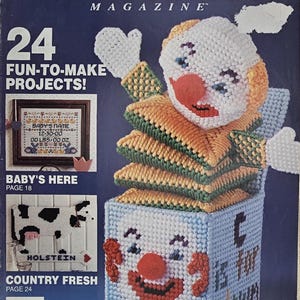 May include: Plastic Canvas! Magazine Number 4, Sept/Oct 1989. The cover features a blue, yellow, and white plastic canvas jack-in-the-box clown, a cross-stitch baby sampler, and a black and white cow design with the text Country Fresh.
