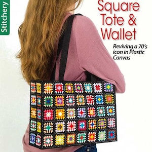 May include: A rectangular tote bag made of plastic canvas featuring a grid of colorful granny square motifs outlined in black. The bag has black fabric straps and the text Granny Square Tote & Wallet Reviving a 70's icon in Plastic Canvas.