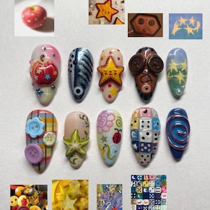 Könnte beinhalten: Eine Sammlung künstlerischer Nageldesigns mit verschiedenen Themen. Designs umfassen einen roten Apfel mit Sternakzenten, ein sternförmiges Design und Nägel, die mit Knöpfen, Würfeln und einem Marienkäfer verziert sind. Die Nägel sind in einer Vielzahl von Farben lackiert.