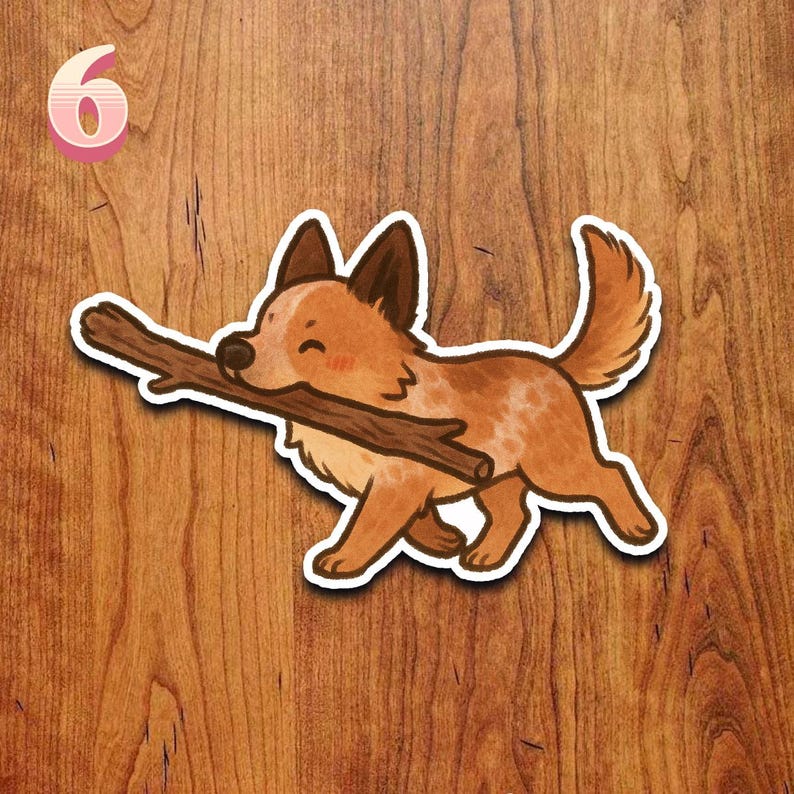 May include: A sticker featuring a cartoon dog carrying a brown stick in its mouth. The dog is brown and white with dark brown ears and a fluffy tail. The number 6 is in the upper left corner.