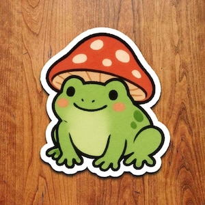 Frog Wearing Mushroom Hat Sticker: Kawaii Toadstool Animal Vinyl Decal
