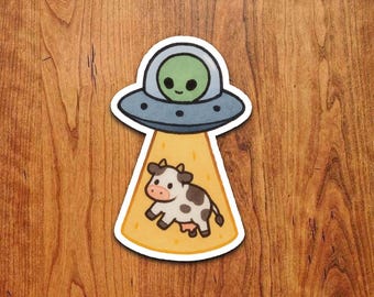 Sticker alien ufo koe ontvoering – grappige kawaii ruimte-vinylsticker
