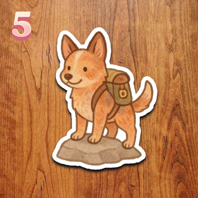 May include: A sticker featuring a cartoon-style dog with reddish-brown fur, wearing a backpack, standing on a rock. The number "5" is in the upper left corner. The background is a wood grain pattern.