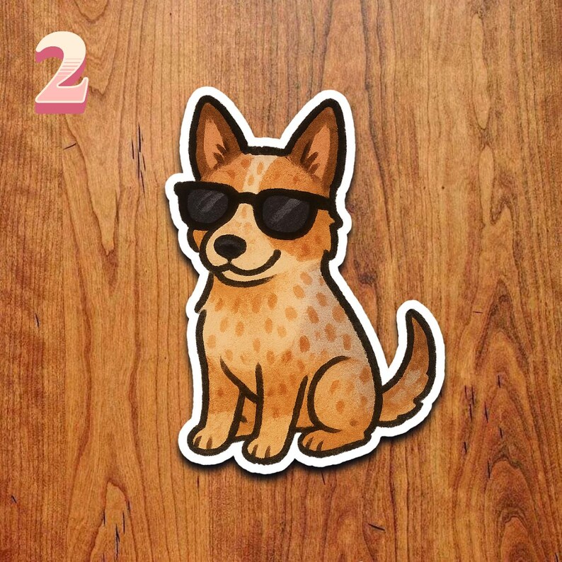 May include: A sticker featuring a cartoon dog wearing black sunglasses. The dog has brown and white fur with a smiling expression. The number "2" is in the upper left corner of the image.