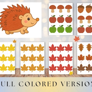 May include: A collection of colorful fall-themed stickers. The stickers include a cartoon hedgehog, mushrooms, apples, acorns, and various leaf designs in yellow, orange, and red. The text "FULL COLORED VERSION" is at the bottom.