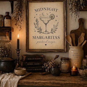 May include: A framed print with the words "Midnight Margaritas practical magic" and a margarita glass illustration. The image is surrounded by candles, jars, and books, creating a mystical, witchy aesthetic.