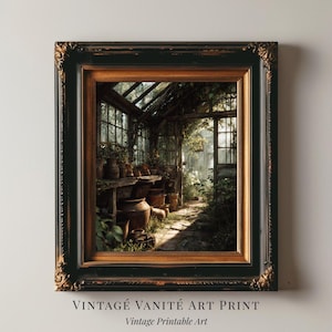 May include: Framed art print showing a greenhouse interior bathed in sunlight. The image presents a detailed view of a greenhouse with plants, pots, and a pathway. The frame is black with gold detailing. Text at the bottom reads "VINTAGE VANITÉ ART PRINT" and "Vintage Printable Art."