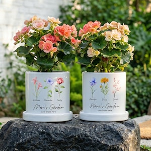 May include: A set of three ceramic mugs with a speckled, matte finish. The mugs are in shades of cream, light gray, and dark gray. Each mug has a simple, minimalist design and a rounded handle.