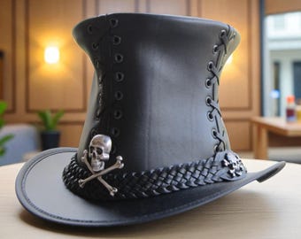 May include: Black leather top hat with a wide brim and a tall, cylindrical crown. The hat features decorative lacing, a braided band, and a silver skull and crossbones emblem. A stylish accessory.