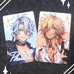 May include: Two rectangular cards featuring anime-style illustrations. One card depicts a character with blue hair, the name "Phainon" in cursive, and paw prints. The other card shows a character with blonde hair, the name "Mydei" in cursive, and paw prints.