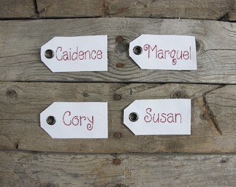 White name tag with embroidered names and your choice of font