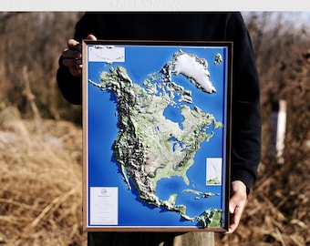 May include: 3D USA map wall art in a wooden frame. The map features a detailed relief of the United States, with shades of green and brown representing the terrain against a blue background. The text "HOME DECOR GIFT" is at the bottom.