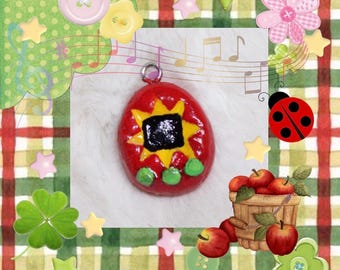 Llavero con colgante de arcilla hecho a mano con diseño de Tamagotchi de Apple