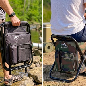 May include: A portable folding stool with an integrated storage bag featuring a black frame and fabric. One version is solid black with a fish logo, and the other is camouflage print with a mountain logo. Both include a side pocket and a drink holder.