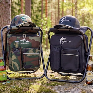 May include: Two portable folding chair backpacks, one in camouflage print with the name Benjamin and a mountain graphic, and one in solid black with the name Malachi and a fish graphic. Each includes a matching baseball cap and glass beer bottles.