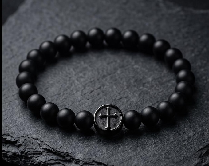 Elegant pearl bracelet with cross symbol