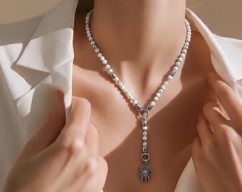 Unisex pearl necklace made of white howlite or black onyx stone with stainless steel elements and stainless steel pendant