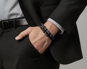 Unisex beaded bracelet as a set made of onyx stone or magnesite turquoise with stainless steel elements.