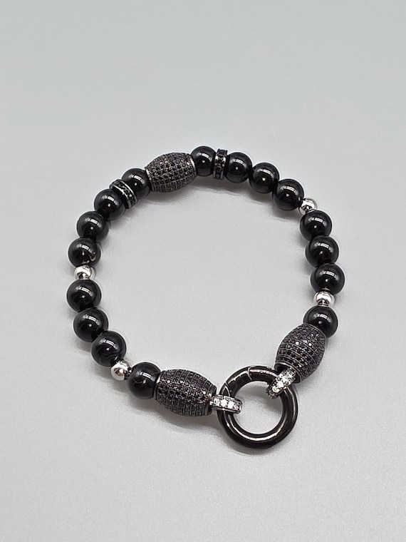 Beaded bracelet made of black onyx stone, stainless steel elements and cubic zirconia stones