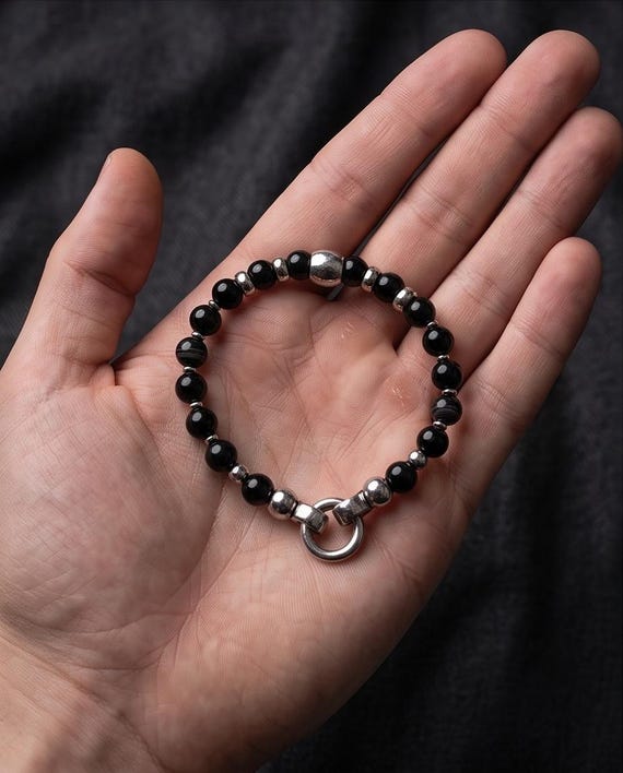 Elegant women's bracelet made of black onyx stone and stainless steel