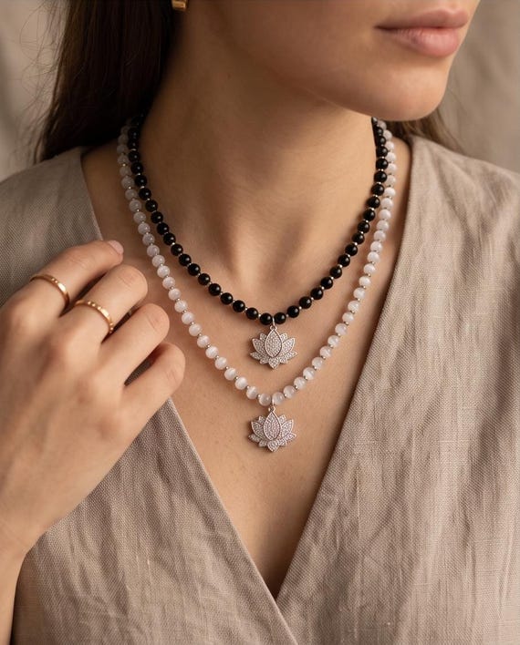Exquisite gemstone pearl necklace with a sparkling lotus pendant made of zirconia and elegant gemstone spacer beads.