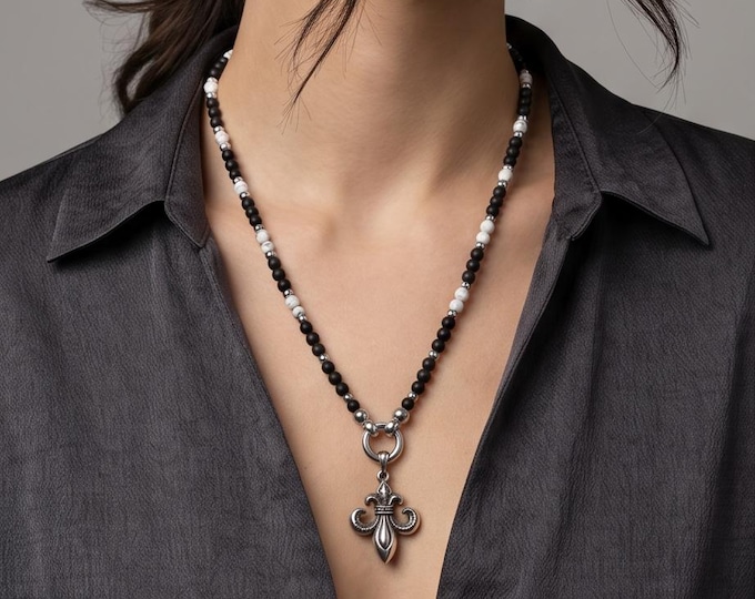 Elegant handmade pearl necklace made of onyx or white howlite with a stainless steel lily pendant.