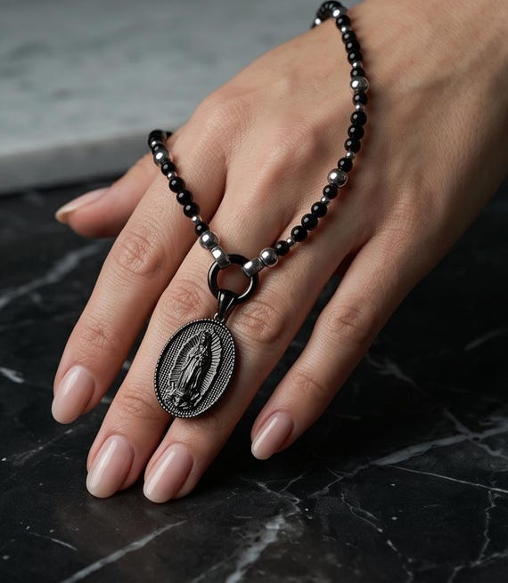 Elegant onyx necklace with a Holy Mary pendant