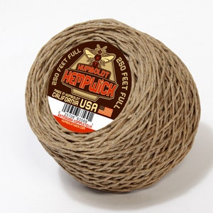 May include: A ball of hemp wick with a brown label that reads "Humboldt Hempwick" and "250 feet full". The label also includes the text "Made in Humboldt California USA".