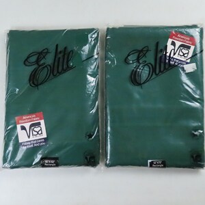May include: Two emerald green rectangular fabric pieces, sealed in clear plastic. Each piece has the word "Elite" in cursive script and a "Visa" label. One label reads "60x102 Rectangle". The other reads "52x70 Rectangle".