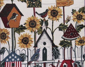 May include: A tapestry featuring a whimsical garden scene with birdhouses, sunflowers, and butterflies. The birdhouses are in various shapes and colors, including one with an American flag design. Birds perch on the birdhouses and sunflowers, creating a charming, nature-inspired design.
