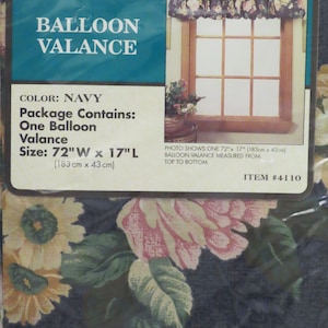 May include: Navy blue floral balloon valance, 72 inches wide by 17 inches long. The package includes one valance. The valance is navy with a floral pattern. The package has the text "BALLOON VALANCE".