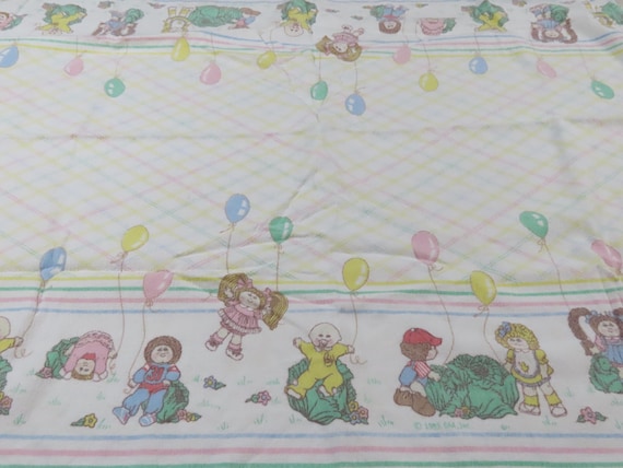 Vintage Cabbage Patch Kids receiving blanket