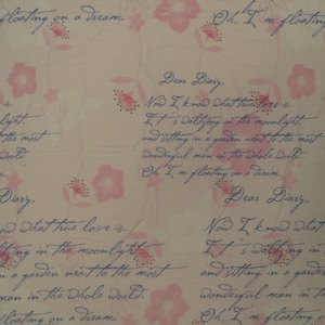 May include: A light beige fabric with a floral pattern and handwritten text. Pink flowers and delicate stems are scattered across the surface. The script reads "Dear Diary" and other romantic phrases.