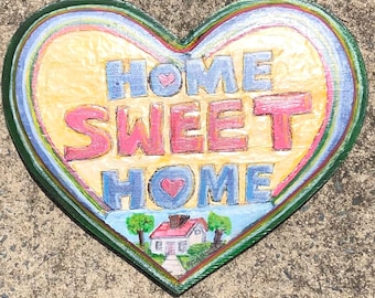 A classically folk "HOME SWEET HOME" sign - Folk Heart-Shaped Wood Relief Sign, Relief-carved letters and a folk-styled house at the bottom