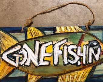 A rustic and primitive handmade folk gone fishin' sign, A folksy, handmade, campy, and whimsical sign, A country and farmhouse style of sign