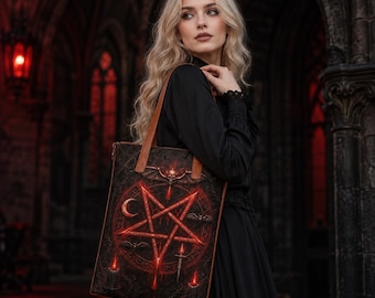 May include: A rectangular tote bag with brown leather-like straps featuring a dark, gothic-inspired print. The design displays a glowing red pentagram, a crescent moon, small bats, and lit candles against a textured, dark, and moody background.