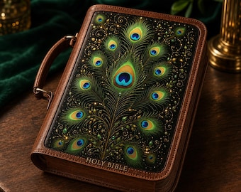 May include: A brown leather-like Bible case with a handle, featuring a vibrant peacock feather design on the front cover. The artwork displays green, blue, and gold eye patterns against a black background. The words HOLY BIBLE are embossed.