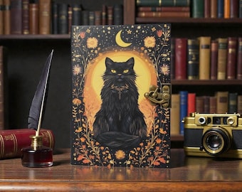 May include: A decorative journal featuring a black cat illustration with yellow eyes, set against a yellow moon and floral design. The journal has a brass clasp and is surrounded by a library setting with books and a quill.