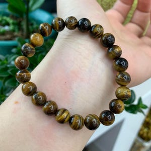 Pulsera de cristal de ojo de tigre natural para protección y confianza, marrón dorado, 8 mm y 10 mm, piedra curativa, regalo para hombres y mujeres, joyería de yoga.