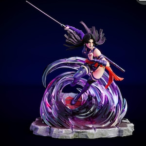 May include: A detailed figurine of a female character in a combat stance, holding a sword. She is dressed in purple and red attire, with long black hair. The figure is encircled by a swirling, translucent purple energy effect, on a stone base.