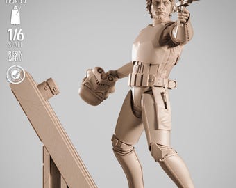 May include: A tan-colored 1/6 scale resin and FDM figure of a character from Star Wars, holding a blaster and a Stormtrooper helmet. The figure is standing on a detailed platform with the Star Wars logo.