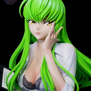 May include: A collectible anime-style figurine featuring a character with long, vibrant green hair and golden eyes. The figure wears a white button-down shirt left partially open to reveal a black lace bra underneath, while holding a document folder.