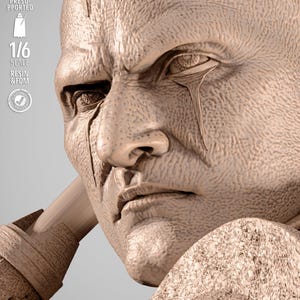 May include: A detailed, close-up of a sculpted bust of a stern-faced figure with a furrowed brow and a tear-like marking under the eye. The bust is a light beige color and features the text "1/6 SCALE RESIN & FDM".