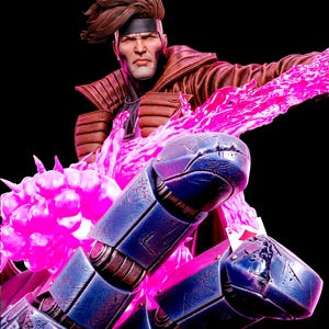 May include: A collectible figurine of a male character with brown hair and a black headband, wearing a brown jacket. The figure is positioned in front of a large, metallic blue robotic hand and is surrounded by bright, glowing pink energy effects.