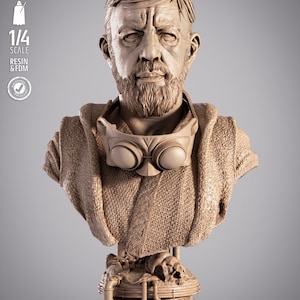 May include: A detailed bust of a Star Wars character, depicting a bearded man wearing goggles. The sculpture is in a neutral tone, with the Star Wars logo at the base. The text on the side indicates it is 1/4 scale.