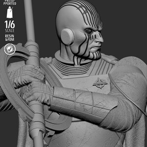 May include: A detailed grayscale sculpture of a humanoid figure with distinctive facial markings and a stern expression. The figure is holding a staff-like weapon and is clad in armor. The image includes text indicating a 1/6 scale and resin/FDM construction.