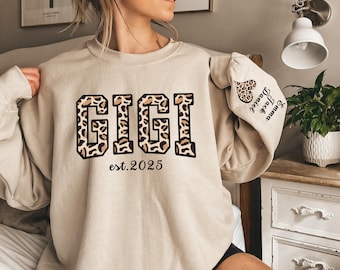 Custom Leopard Gigi Sweatshirt With Kid Name On Sleeve, Personalized Gigi Sweatshirt, Gift For Gigi, Christmas Gift Gigi Est 2025 Sweatshirt